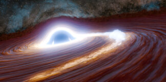 Gaura neagră care devorează stele declanșează o explozie energetică record