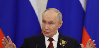 Putin se confruntă cu două viziuni opuse asupra războiului și păcii la „Davosul Rusiei”